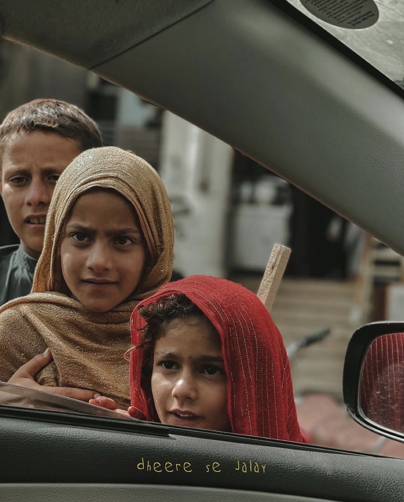 Portrait through a car window